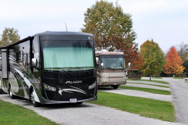 Two RVs parked next to each other